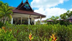 A traditional building with a pointed roof and a decorative emblem. - P.S Hill Resort (Patong)