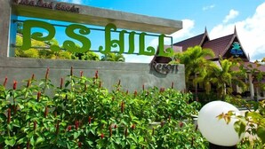 A sign with the text "P.S. Hill" and "P.S. Hill Resort" indicating the name of the property. - P.S Hill Resort (Patong)
