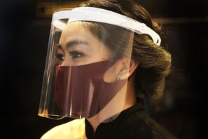 A person wearing a face shield and a headband. - T Series Place Serviced Apartment (Bangkok)