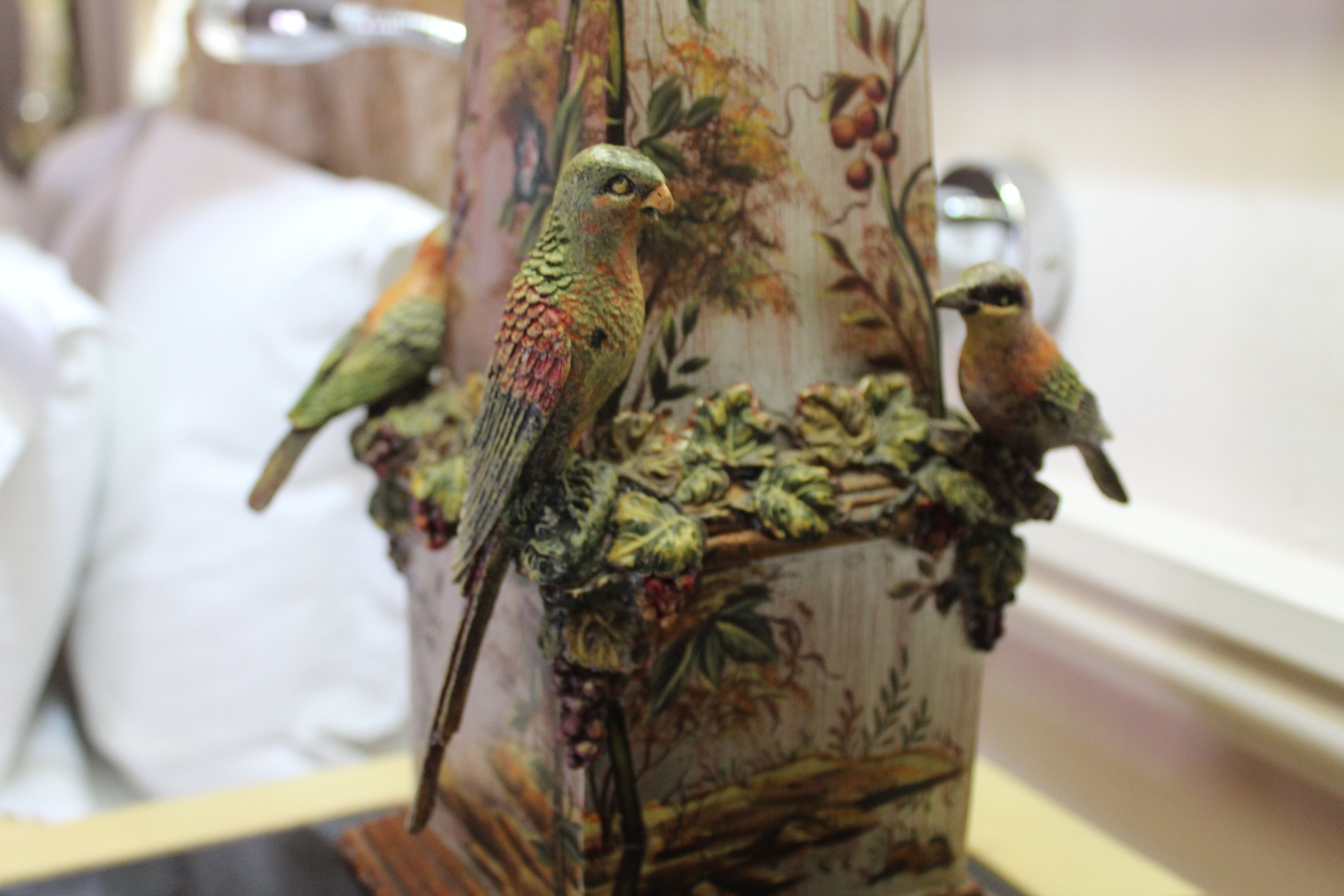 A decorative bird sculpture on a column.