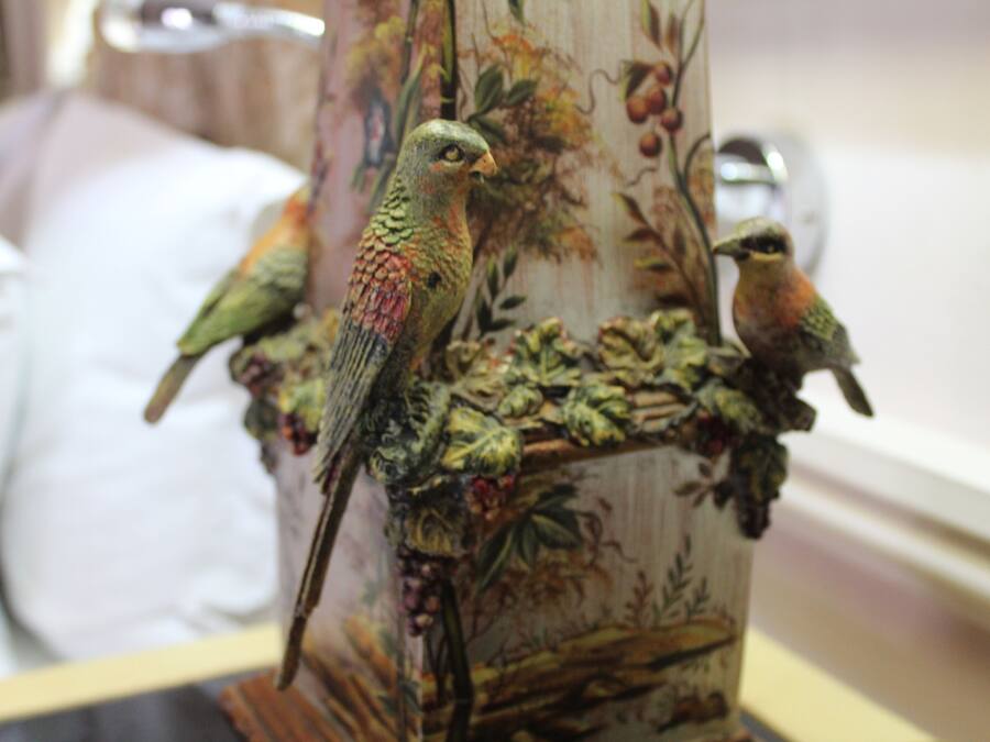 A decorative bird sculpture on a column.