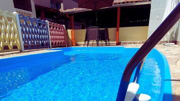 Outdoor pool, open 10:00 AM to 10:00 PM, pool umbrellas, pool loungers