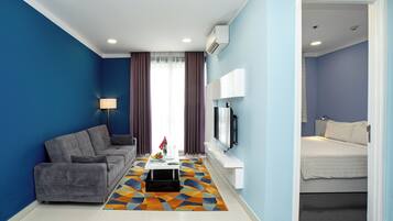 Standard Room | Living area | 40-inch flat-screen TV with cable channels, TV