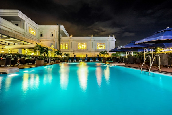Outdoor pool, open 6:00 AM to 9:30 PM, sun loungers