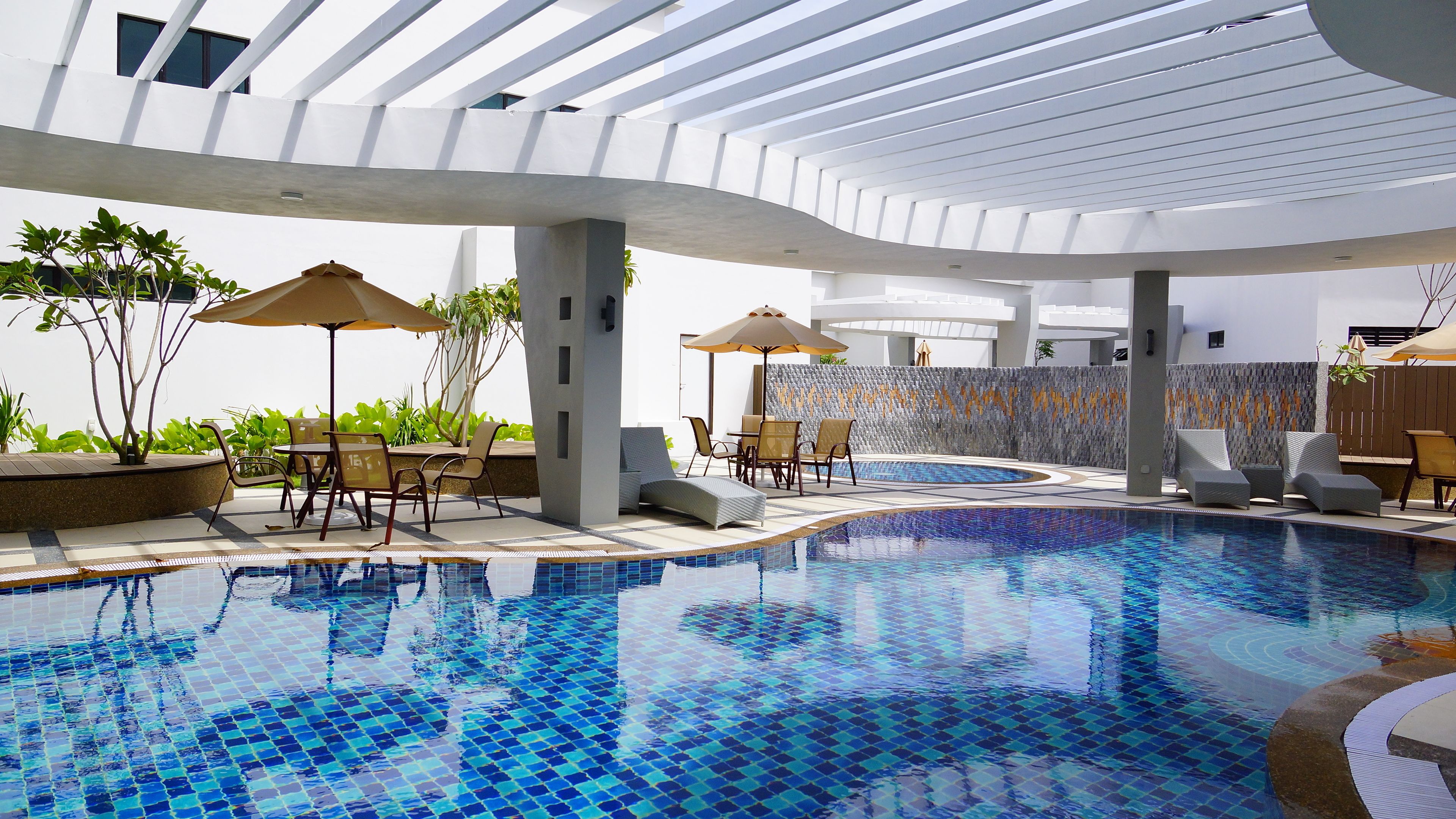 outdoor pool, pool umbrellas, pool loungers