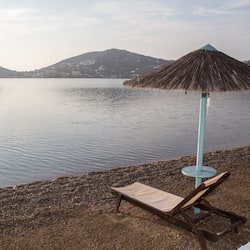 On the beach, sun-loungers, beach umbrellas, beach towels