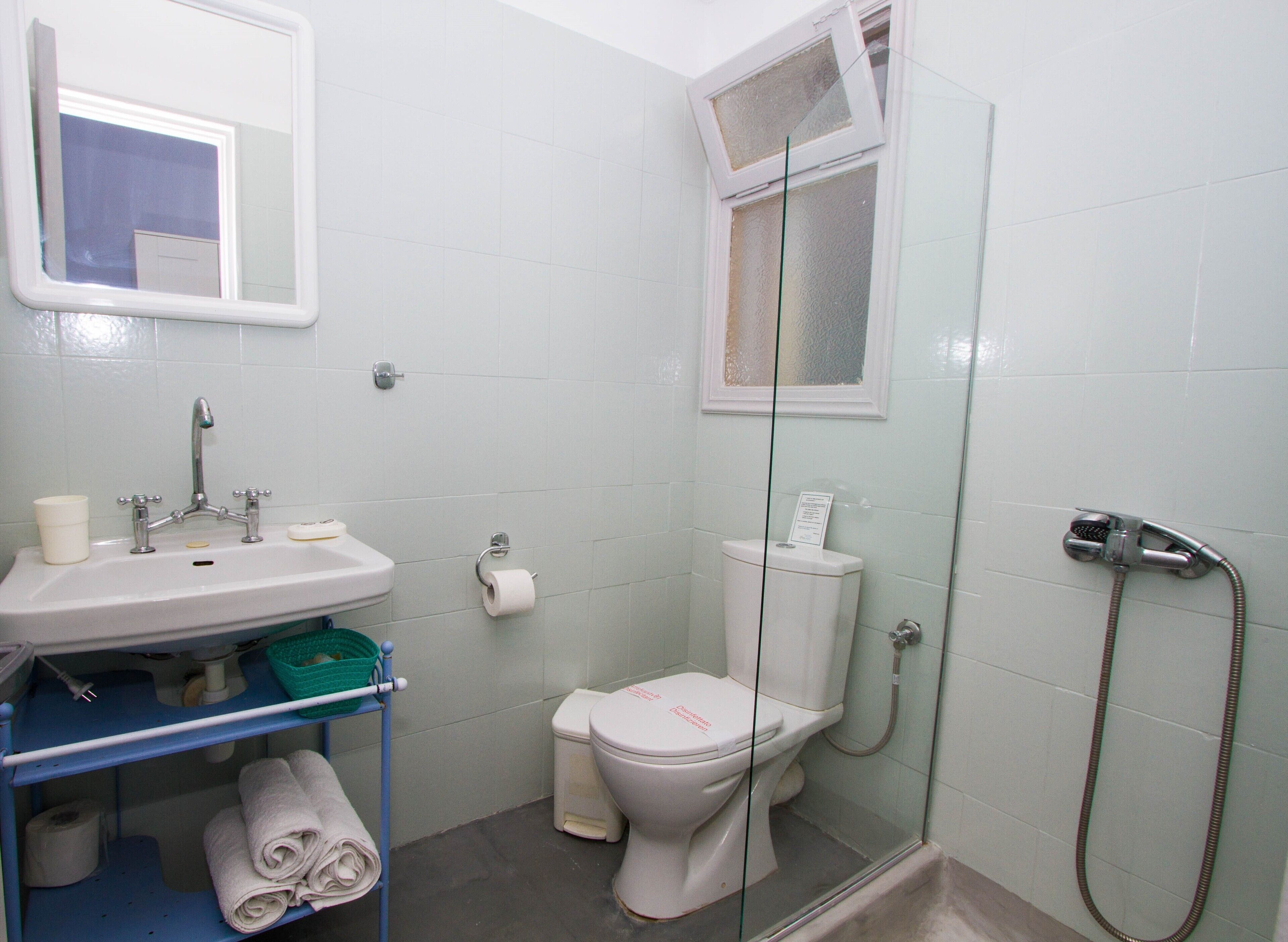 standard room, sea view | bathroom | shower, hair dryer, slippers, towels