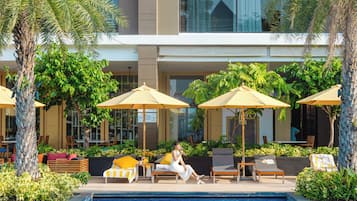 Outdoor pool, open 7:00 AM to 7:00 PM, free pool cabanas, pool umbrellas