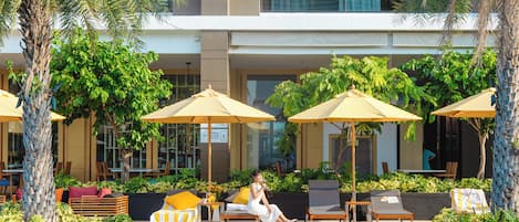 Outdoor pool, open 7:00 AM to 7:00 PM, free cabanas, pool umbrellas