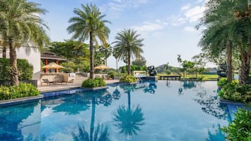 Outdoor pool, open 7:00 AM to 7:00 PM, free cabanas, pool umbrellas