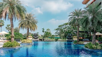 Outdoor pool, open 7:00 AM to 7:00 PM, free cabanas, pool umbrellas