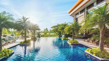 Outdoor pool, open 7:00 AM to 7:00 PM, free cabanas, pool umbrellas