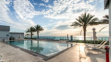 2 outdoor pools, a heated pool, open 6:00 AM to 8:00 PM, pool umbrellas