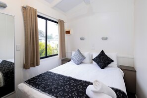 Familie villa, 2 slaapkamers | Verduisterende gordijnen, een strijkplank/strijkijzer, beddengoed