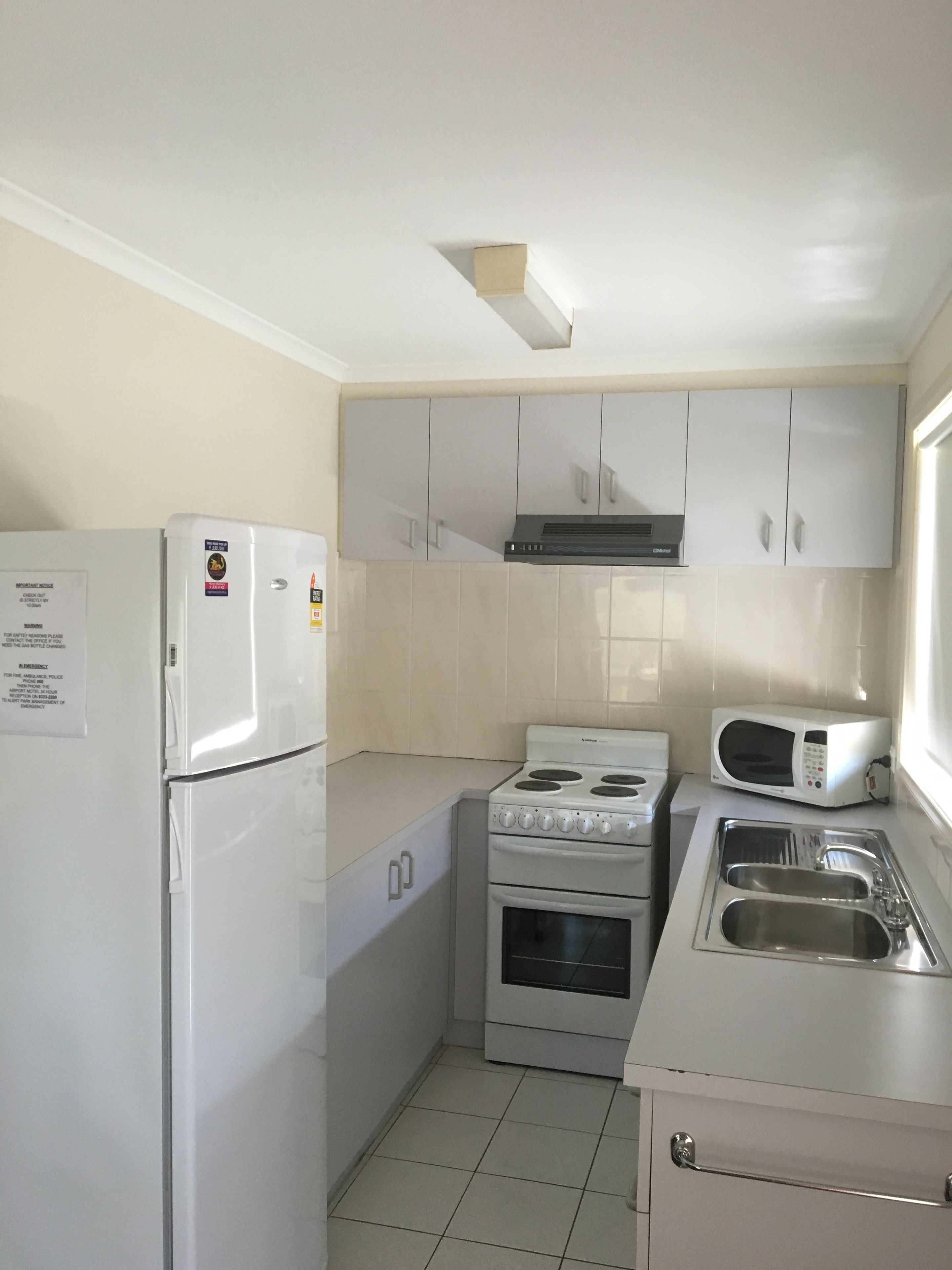deluxe 1 bedroom apartment | private kitchen | full-sized fridge, microwave, oven, dishwasher