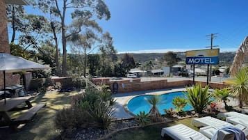 Outdoor pool, pool umbrellas, sun loungers