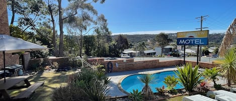 Outdoor pool, pool umbrellas, sun loungers