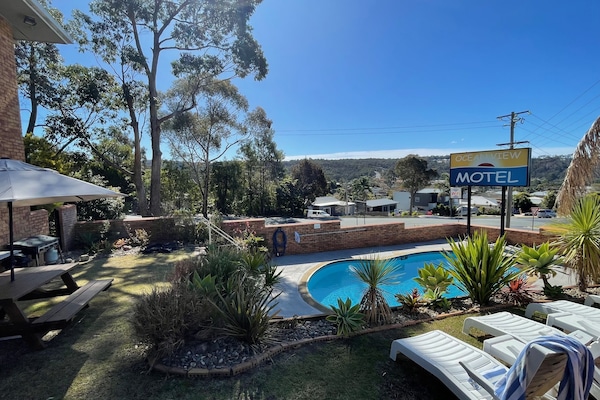 Outdoor pool, pool umbrellas, sun loungers