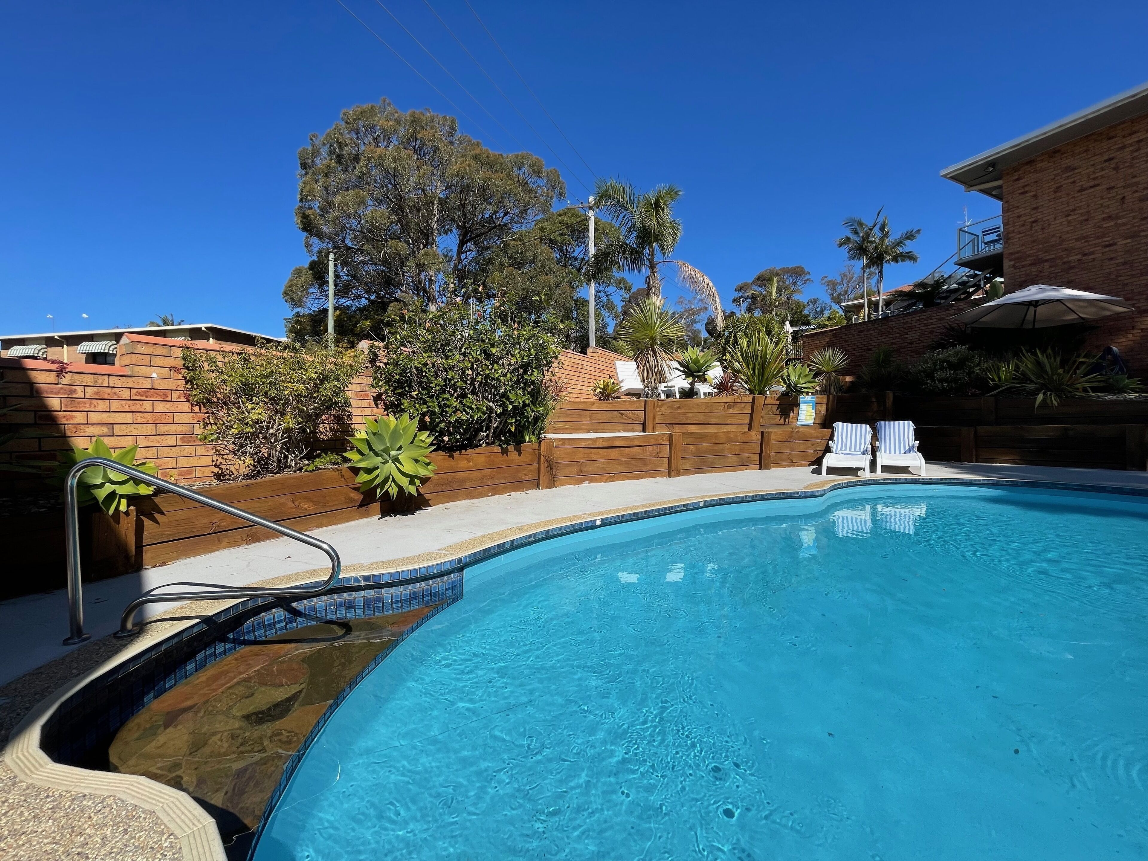 Outdoor pool, pool umbrellas, sun loungers