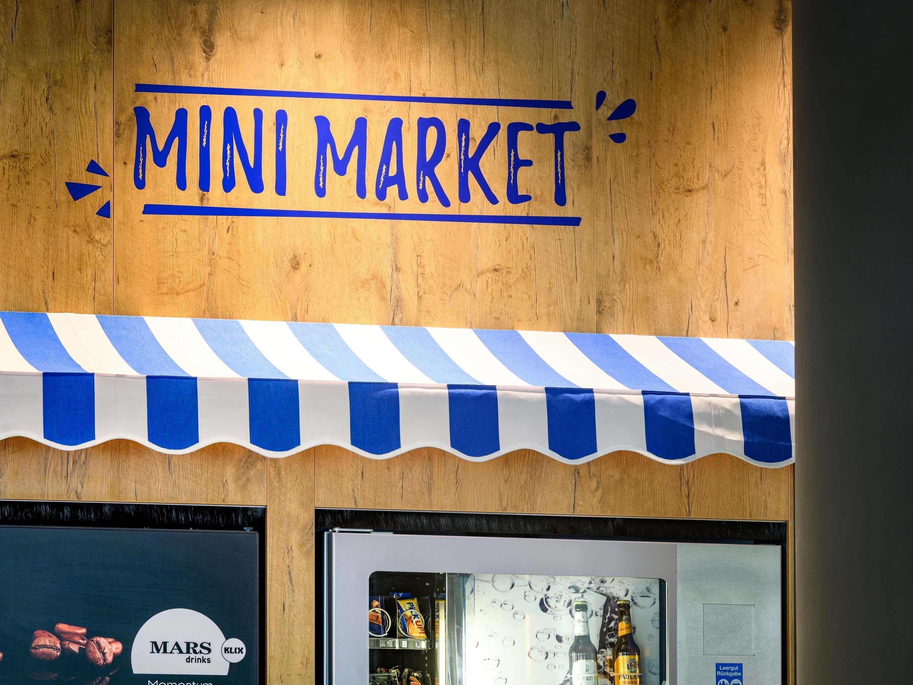 A wooden wall with a blue and white striped awning and the text 'MINI MARKET' above it.