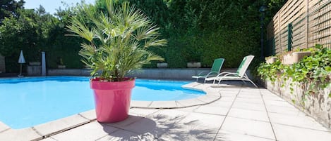 Seasonal outdoor pool, pool loungers