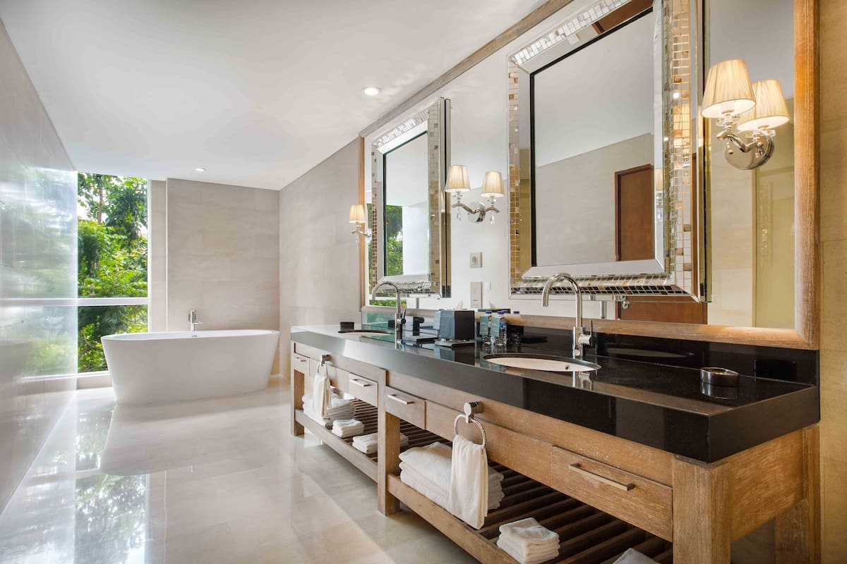 presidential suite, 1 king bed | bathroom | hair dryer, slippers, towels