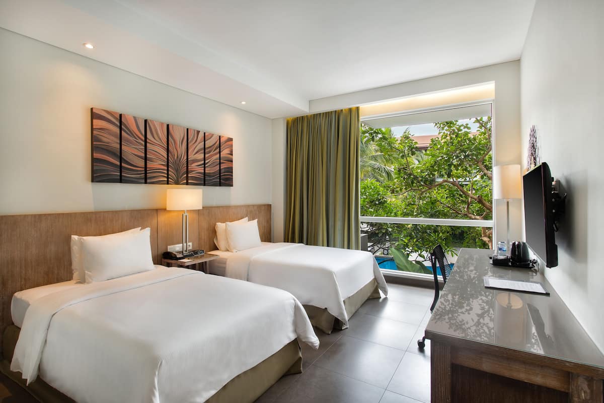 twin room, 2 single beds, pool view | premium bedding, minibar, in-room safe, desk