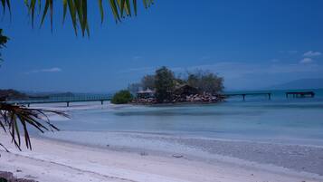 On the beach, white sand, beach towels, scuba diving