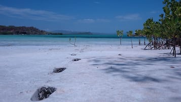 On the beach, white sand, beach towels, scuba diving