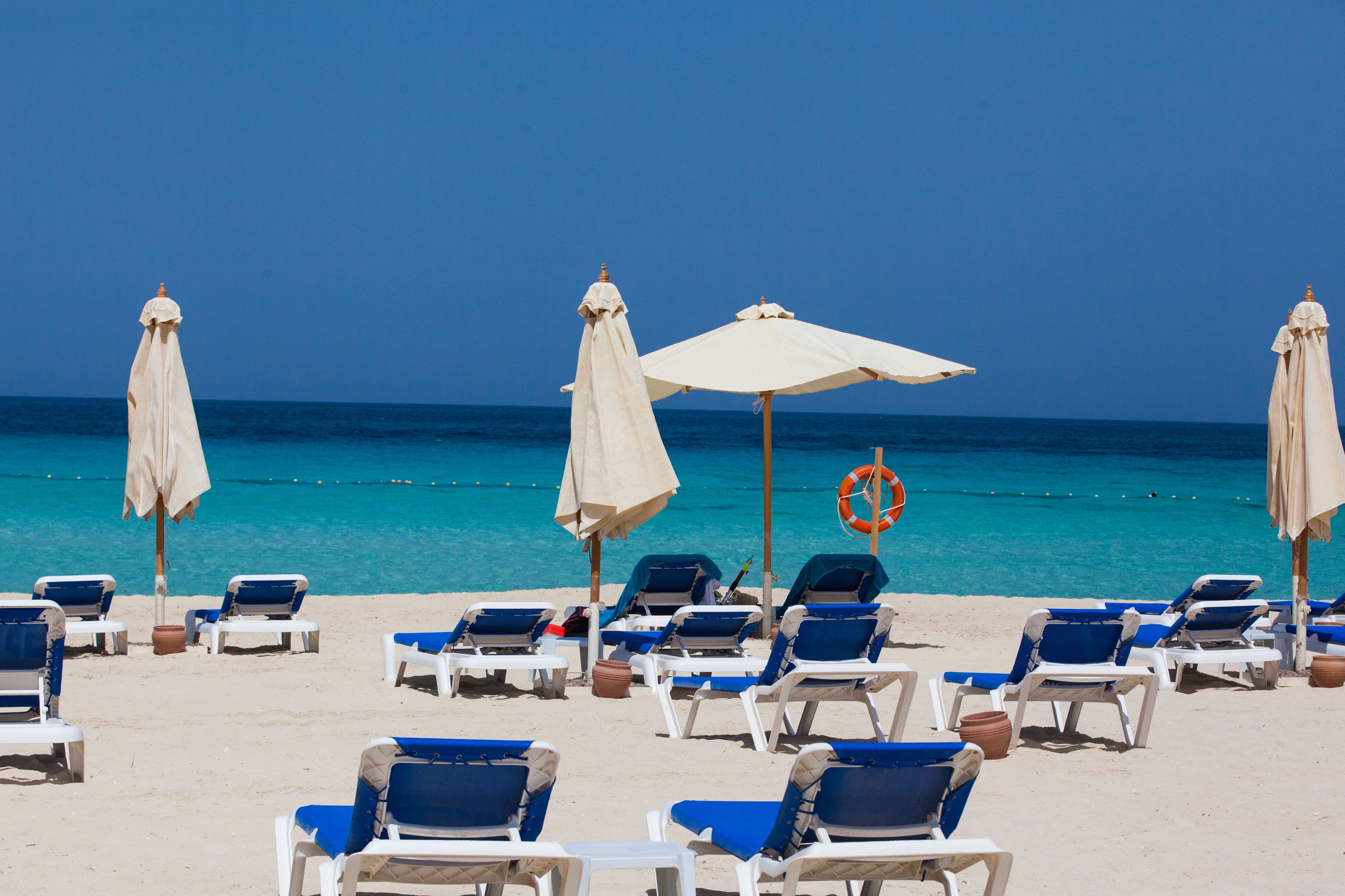 private beach, white sand, beach cabanas, sun-loungers