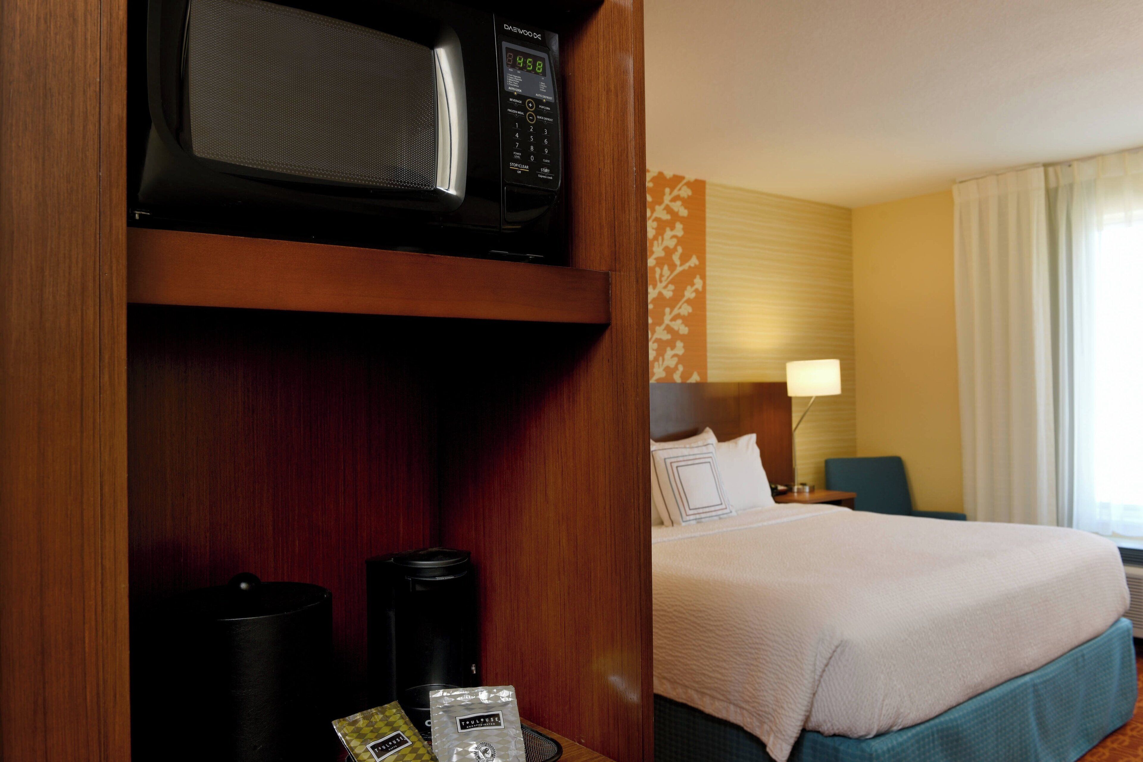 desk, laptop workspace, blackout curtains, iron/ironing board