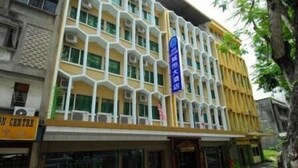 A multi-story hotel with a distinctive geometric facade, large windows, and a prominent blue sign indicating the name. - Hotel City Star (Sandakan)