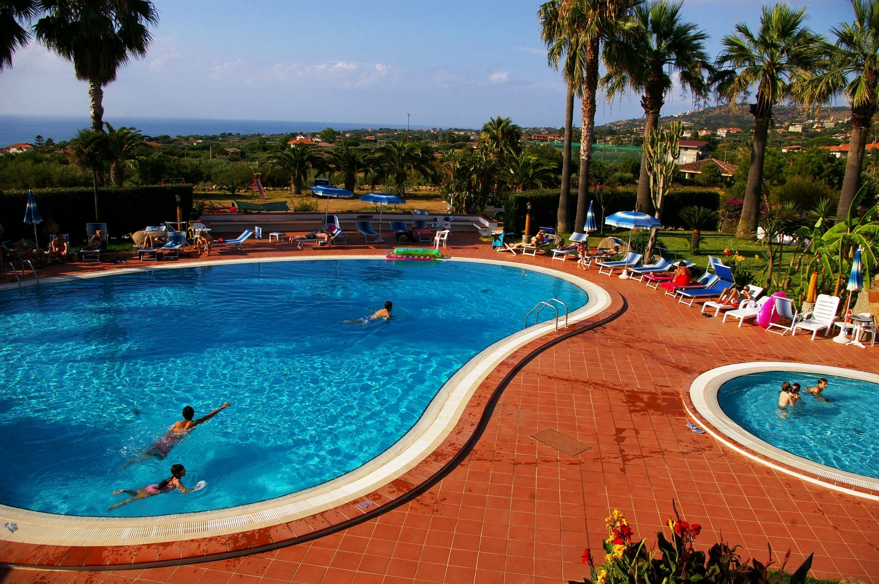 Outdoor pool, pool umbrellas, sun loungers