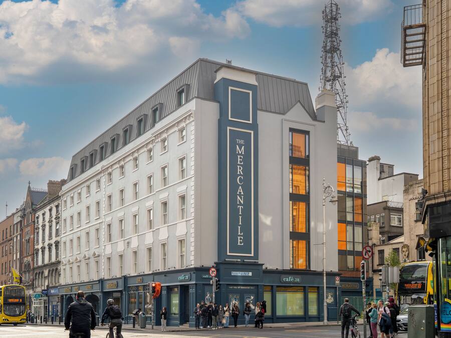 A multi-story building with a prominent sign reading 'The Mercantile.'
