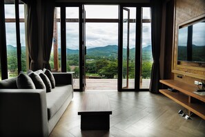 2 Bedroom Pool Villa Grand Mountain View | Living area | 32-inch LCD TV with satellite channels, TV, DVD player - Puripai Villa Wellness & Retreat (Pai)