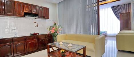 Deluxe Studio, Kitchen, City View | Living room | LCD TV