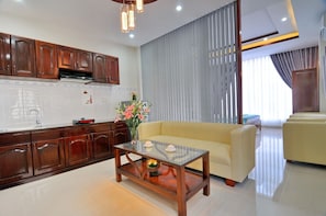 Deluxe Studio, Kitchen, City View | Living room | LCD TV - Duy Phuoc Hotel (Nha Trang)