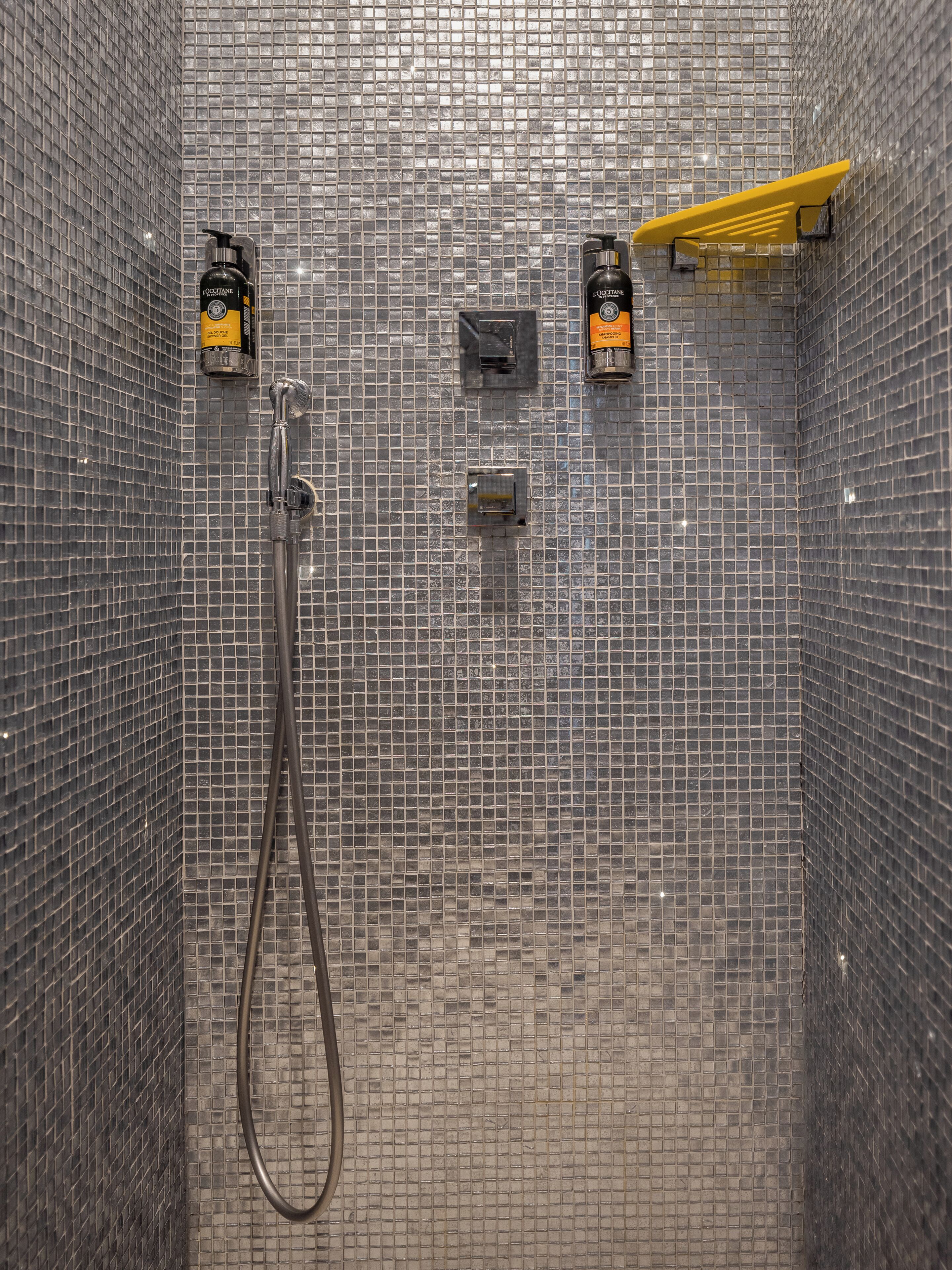 junior suite | bathroom | shower, hair dryer, towels, shampoo