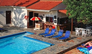Outdoor pool, pool umbrellas, sun loungers