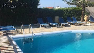 Outdoor pool, pool umbrellas, pool loungers