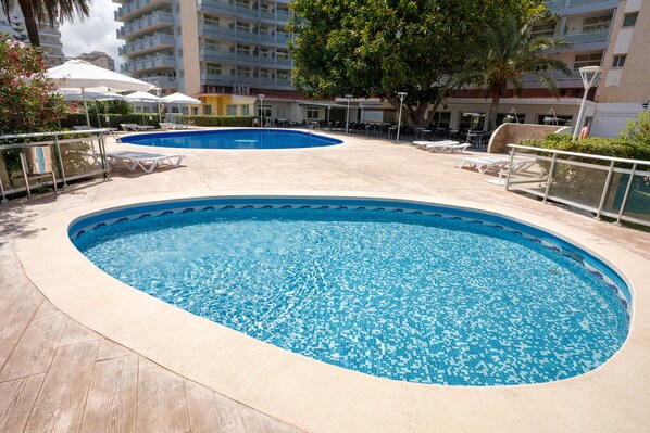 Indoor pool, outdoor pool, pool umbrellas, pool loungers
