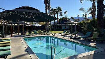 2 outdoor pools, pool umbrellas, pool loungers