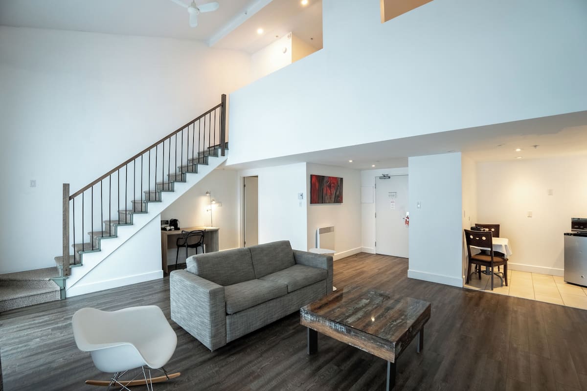 Suite, 1 King Bed, Non Smoking, Balcony (Living Room;with Sofabed) | Living area | 30-inch plasma TV with cable channels, TV