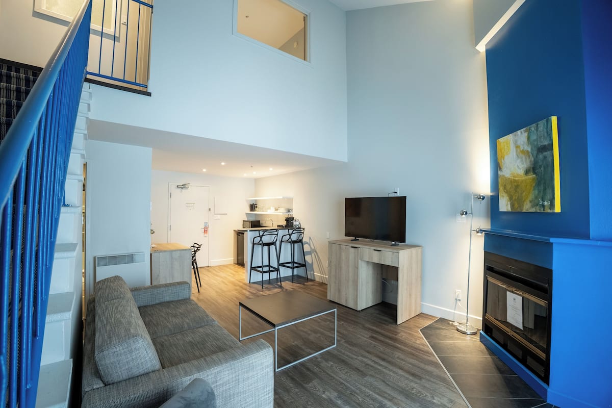 Suite, 1 King Bed, Non Smoking, Balcony (Living Room;with Sofabed) | Living area | 30-inch plasma TV with cable channels, TV