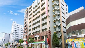 A multi-story hotel with a modern design, featuring balconies on each floor, a visible entrance, and a sign indicating it is a hotel. - Hotel Relief Namba Daikokuchou (Osaka)