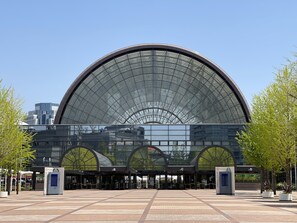 A modern building with a large glass dome and three entrances labeled B, C, and D. - Hotel Relief Namba Daikokuchou (Osaka)