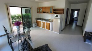 Family Apartment, 2 Bedrooms, Pool Access, Pool View | Living area | 32-inch LCD TV with cable channels, TV - Babylon Pool Villas (Rawai)