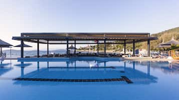 Indoor pool, seasonal outdoor pool, pool umbrellas, pool loungers