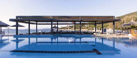 Indoor pool, seasonal outdoor pool, pool umbrellas, pool loungers