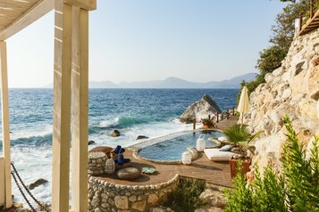 Seasonal outdoor pool, pool umbrellas, pool loungers